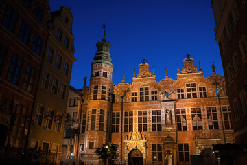 Fototapeta na wymiar Gdansk, North Poland : Wide angle night shot of a Long Lane street in Old town displaying Polish architecture against clear blue night sky