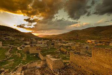 sunset in syriac village qillit mardin, old and ruined stone town, panaroma of an abandoned...