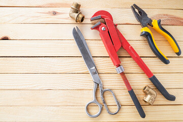 domestic plumber accessories set on a wooden desk. tools for housework