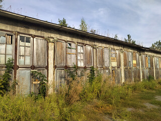 Fototapeta na wymiar Wooden doors of old two-storey warehouse