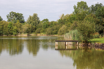 Fototapeta na wymiar Nouvelle-Aquitaine - Charente-Maritime - Aigrefeuille d'Aunis - Ponton sur le Lac de Frace pour les pêcheurs