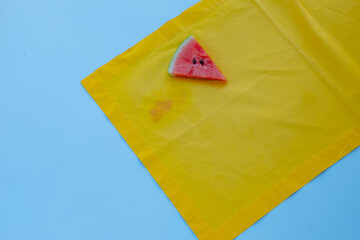 Yellow tablecloth in a stain of watermelon. daily life dirty stain for wash and clean concept