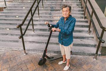 Old woman near scooter. Grandmother progressive woman. Senior having fun. Old woman enjoying her hobbies. Retired lady using modern clean transport. New generation. Mature woman loving her e scooter