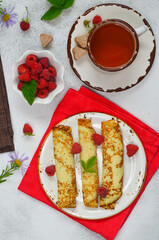 A cup of tea with pancakes on Shrovetide. Pleasant home-made tea