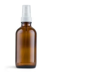 Amber glass bottle with spray on white background. Mockup and copy space available.