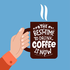 The best time to drink coffee is now. Mug in hand and the phrase lettering about coffee. Graphic design lettering. Handwritten lettering design elements for cafe decoration and shop advertising.