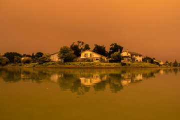 Orange Skies Over Suburban Lake Due to August Complex Fires in California