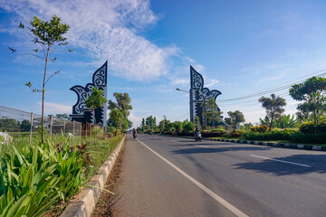 Big gate in to Purwakarta city, under blue sky 