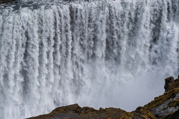 Water falling on Dettifoss waterfall in Iceland.
