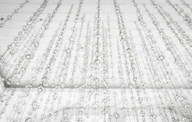 Abstract background with bokeh effect. Blurred defocused lights in white colors