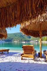 Bodrum, Turkey - August 2020: Hotel beach Lujo. Vacation in Paradise. Beautiful tropical beach banner. White sand travel tourism wide panorama background concept. Amazing beach landscape, yachts © Helen