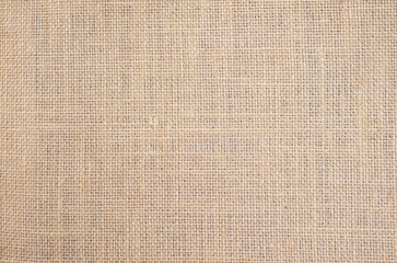 Fototapeta na wymiar Light brown linen background Weaving Canvas Fabric Texture background. or Natural brown cloth surface.