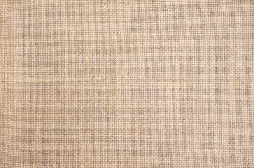 Light brown linen background Weaving Canvas Fabric Texture background. or Natural brown cloth surface.