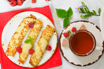 A cup of tea with pancakes on Shrovetide. Pleasant home-made tea