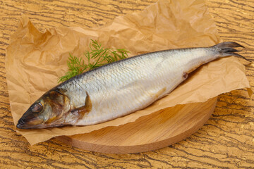 Salted herring over the wooden board