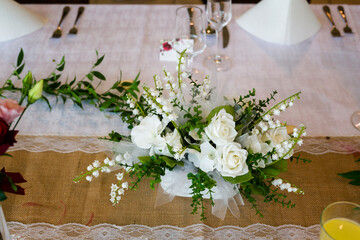 Flowers on the wedding table.