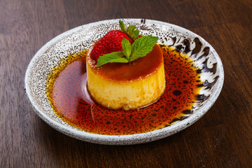 Panna cota with syrope and strawberry