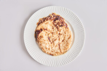 Pupusas from El Salvador dish isolated with curtido on a stylish white plate