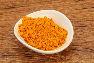 Tumeric powder in the bowl