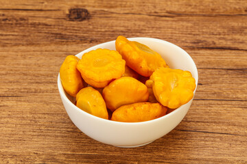 Marinated yellow patisson in the bowl