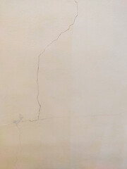 wall with a crack, old beige building wall