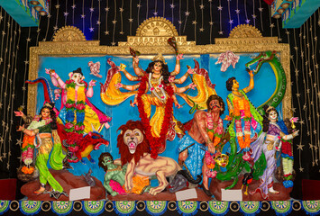 Durga Puja or Durgotsava,is an annual Hindu festival celebrated mainly in West Bengal,India.Durga is Goddess riding a lion with many arms each carrying weapons and defeating evil power of Mahishasura.