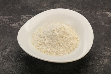 Wheat flour heap in the bowl