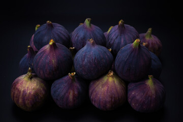 Tasty figs on a black background. Top view.