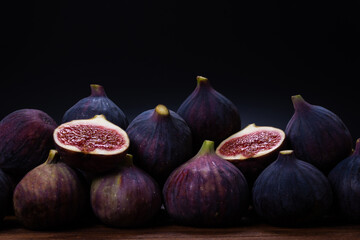 Tasty figs on a black background. Top view.