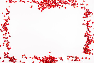 Pomegranate seeds isolated on white.