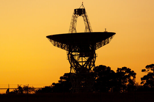 Close up isolated silhouette image of a large radio telescope antenna used for deep space exploration in Wallops Flight Facility of NASA The large satellite dish is facing towards the sky.
