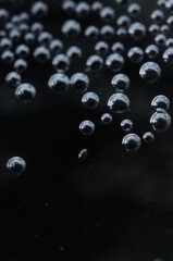 Large air bubbles in a dark space with a metallic glow