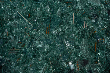Closeup of broken car glass shards. Shiny Texture