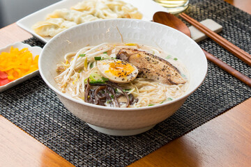 Japanese style ramen noodle with soft boiled egg and wooden chopstick