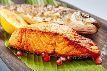 Fish served on wooden rustic plate