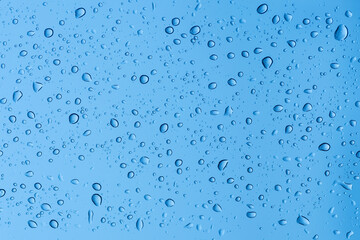 Natural water drops on window glass background.