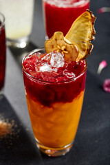 Cuba sling cocktail on dark stone background