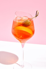 Aperol spritz on pink background