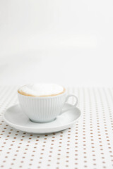 cappuccino on dot pattern paper