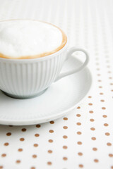 Fototapeta na wymiar cappuccino on dot pattern paper