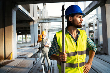 Portrait of construction architect, engineer working on building site