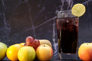 glass of burry juice and fruits