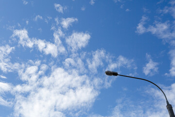 Lamppost against the blue sky