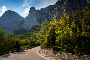 asphalted road in the mountains, beautiful sunshine, summer vacation time