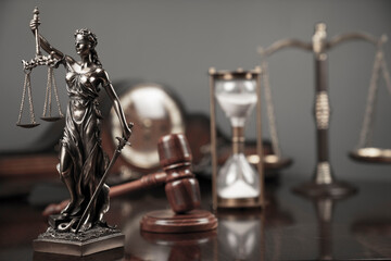 Fototapeta na wymiar Lawyers office concept. Law symbols composition: Themis sculpture, gavel and scale.