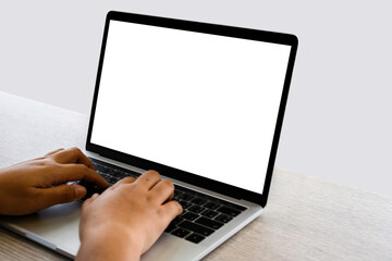 Businesswoman hand using laptop computer mockup white background on desk at coffee cafe. computer with blank screen.
