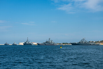 A group of warships at the seaport.