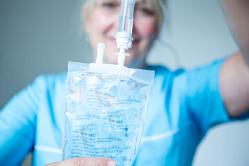 Healthcare - nurse with drip feed.