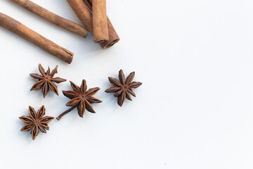 star anise on a white background. this aromatic spice is used for cooking food and various drinks