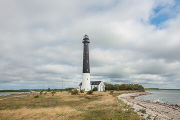 Fototapeta na wymiar Sightseeing of Saaremaa island. Sõrve lighthouse is a popular landmark and scenic location on the Baltic sea coast